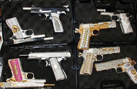 Gold and silver plated guns with jewels, confiscated from cartel members in Mexico.
