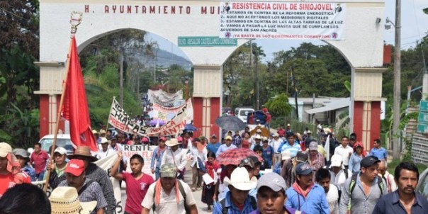 The banner hung on the entrance to the town says: "resistencia civil" or civilian resistance.
