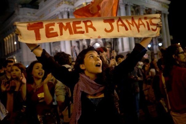 A Brazilian protester's sign reads: "Never Temer."