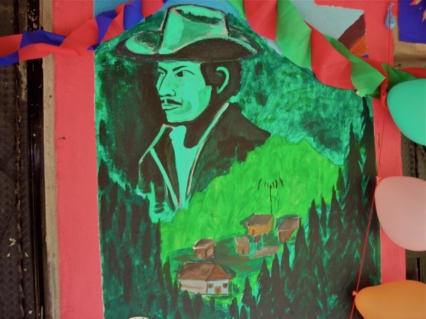 A mural  on the front of the Good Government Junta's offices in La Garrucha includes the image of Francisco Gomez, one of the EZLN's early organizers in this Zone. He dies in the bloody battle of Ocosingo in January 1994.