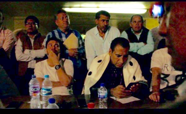 Eduardo Ramírez dressed as a Tsotsil woman listens to residents' demands in Chenalhó, Chiapas.